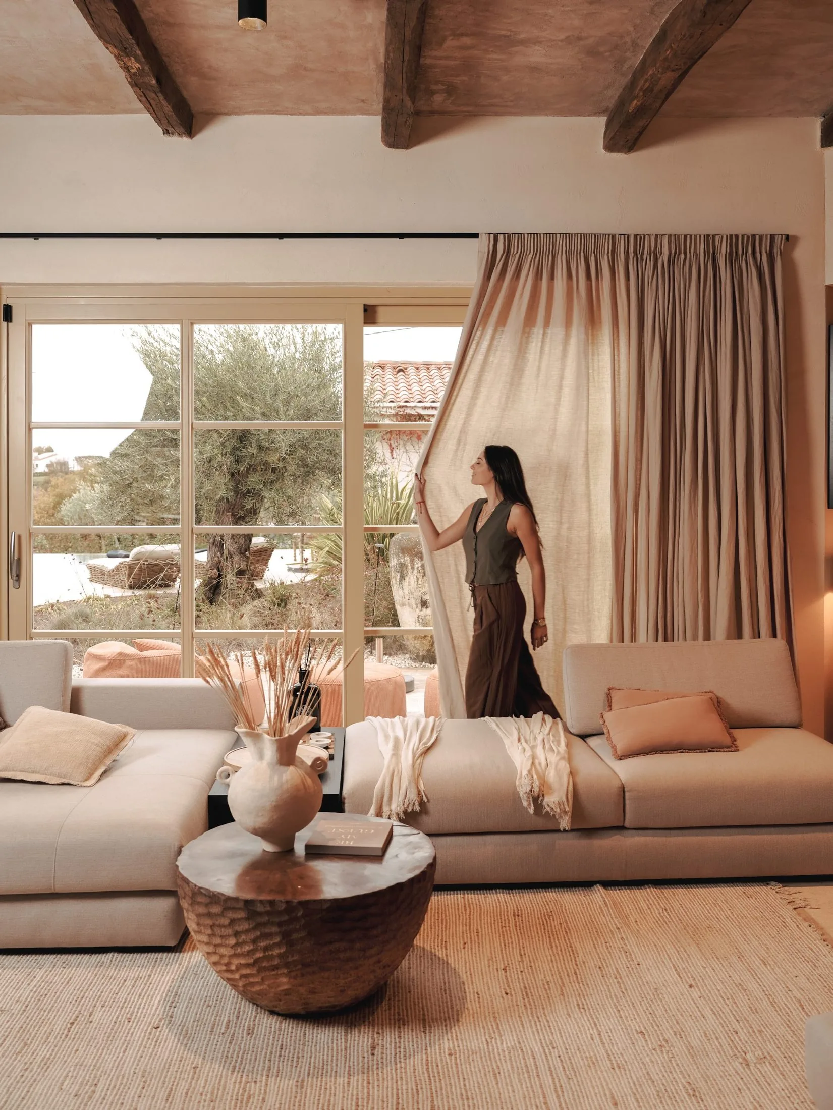 The living room at LaMaison, olive trees through the window, inland Istria