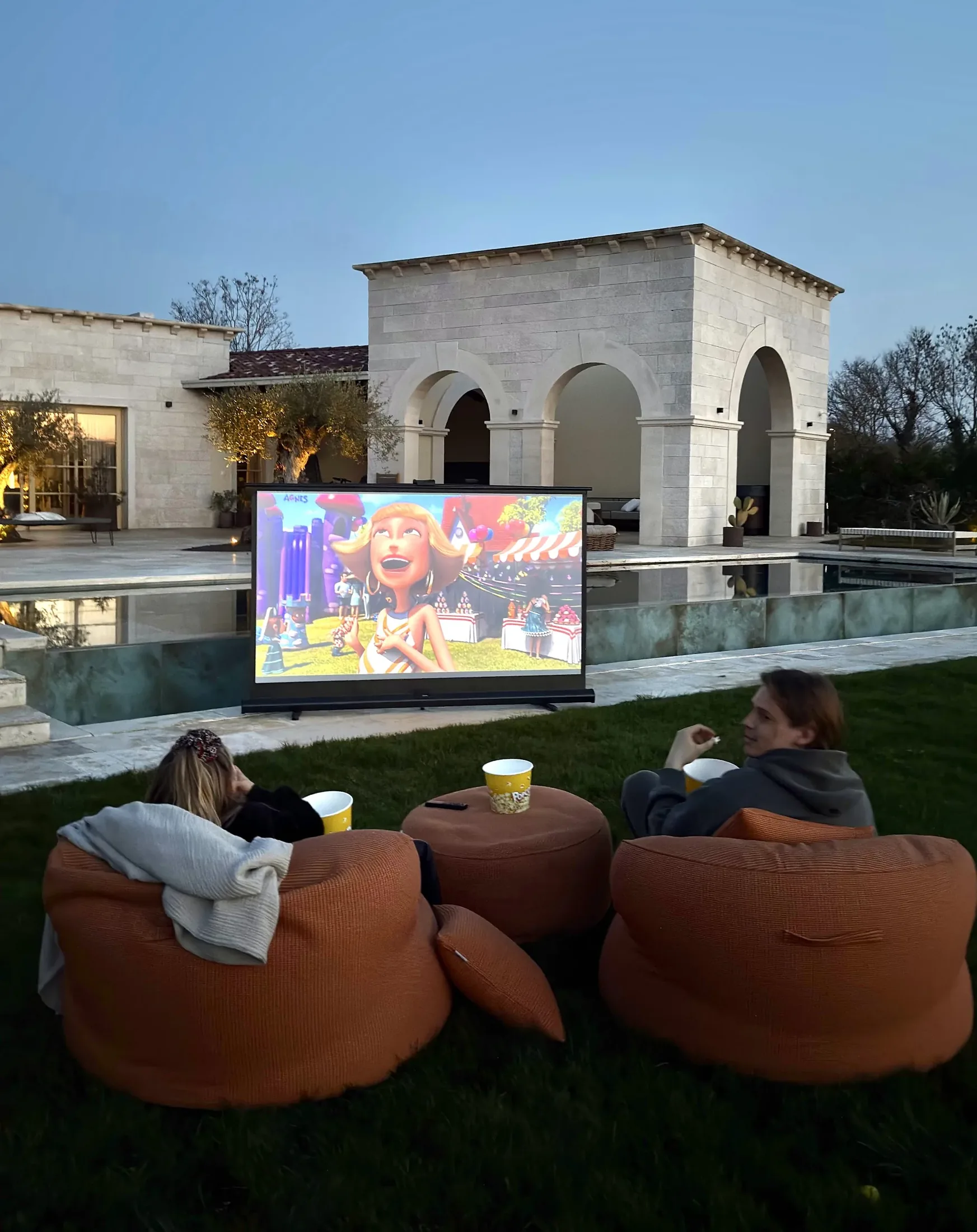 An outdoor cinema under the stars by the pool at LaMaison