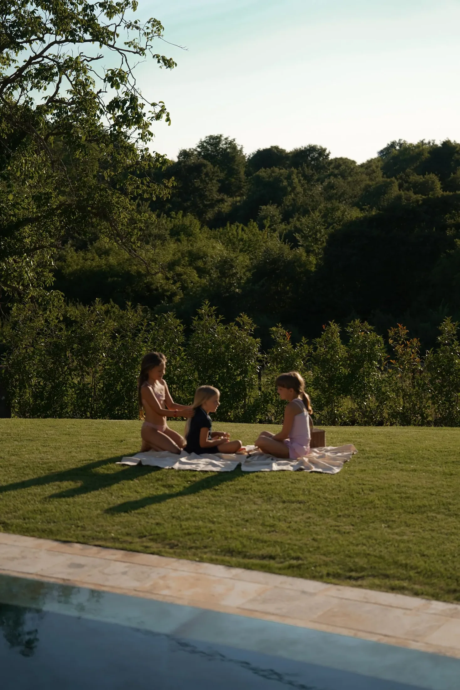 A family on the lawn at LaMaison