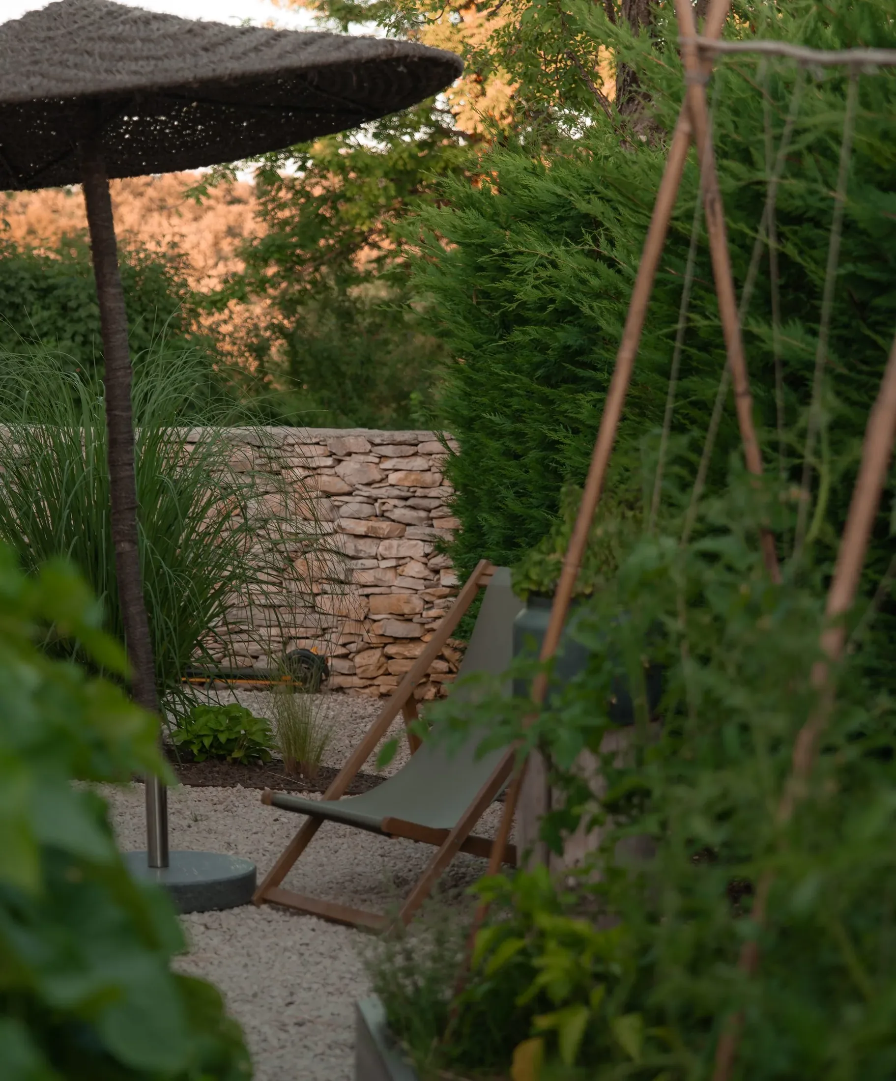 A chair in the green garden at LaMaison