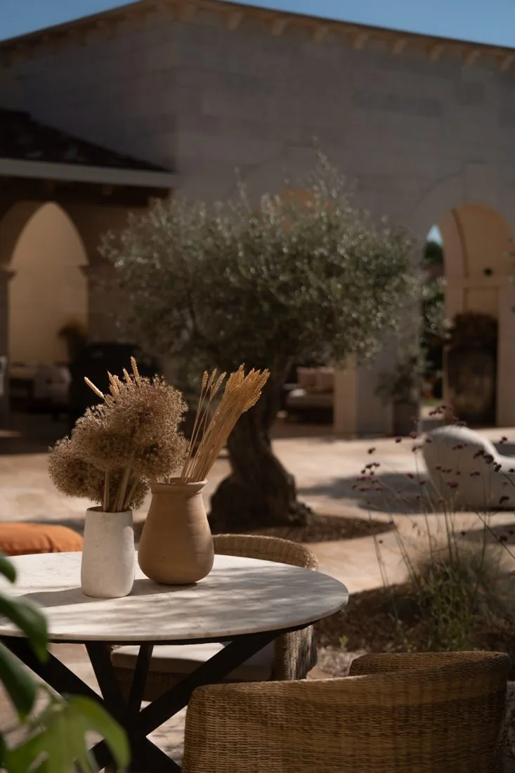 Dried wild grasses on a terrace table at LaMaison