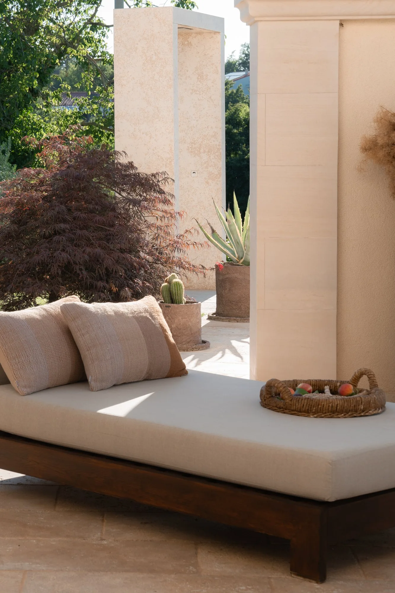A daybed on the terrace at LaMaison