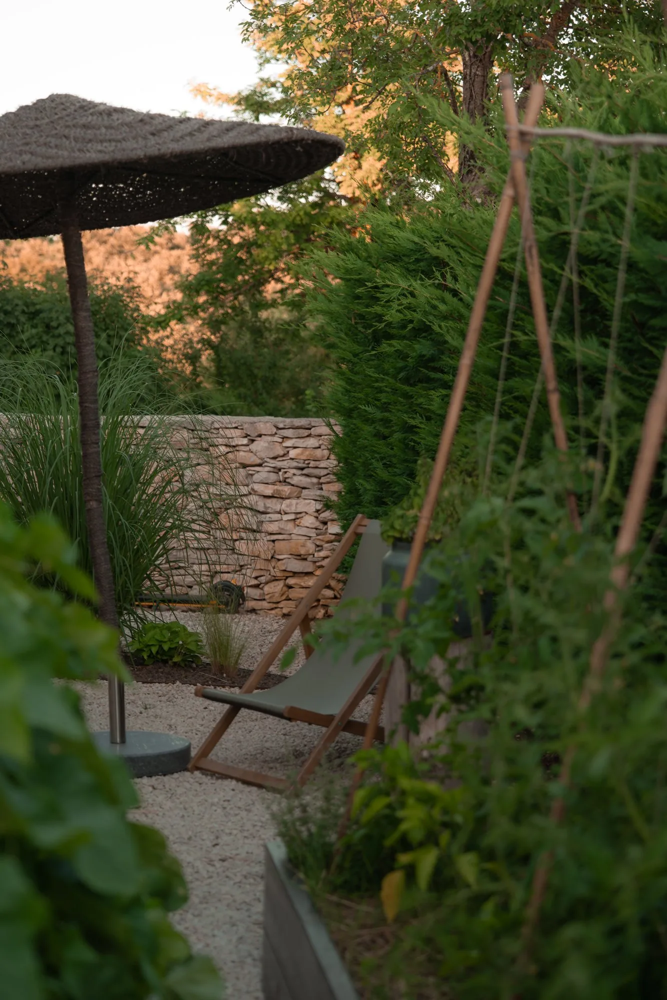 A chair set in the garden at LaMaison