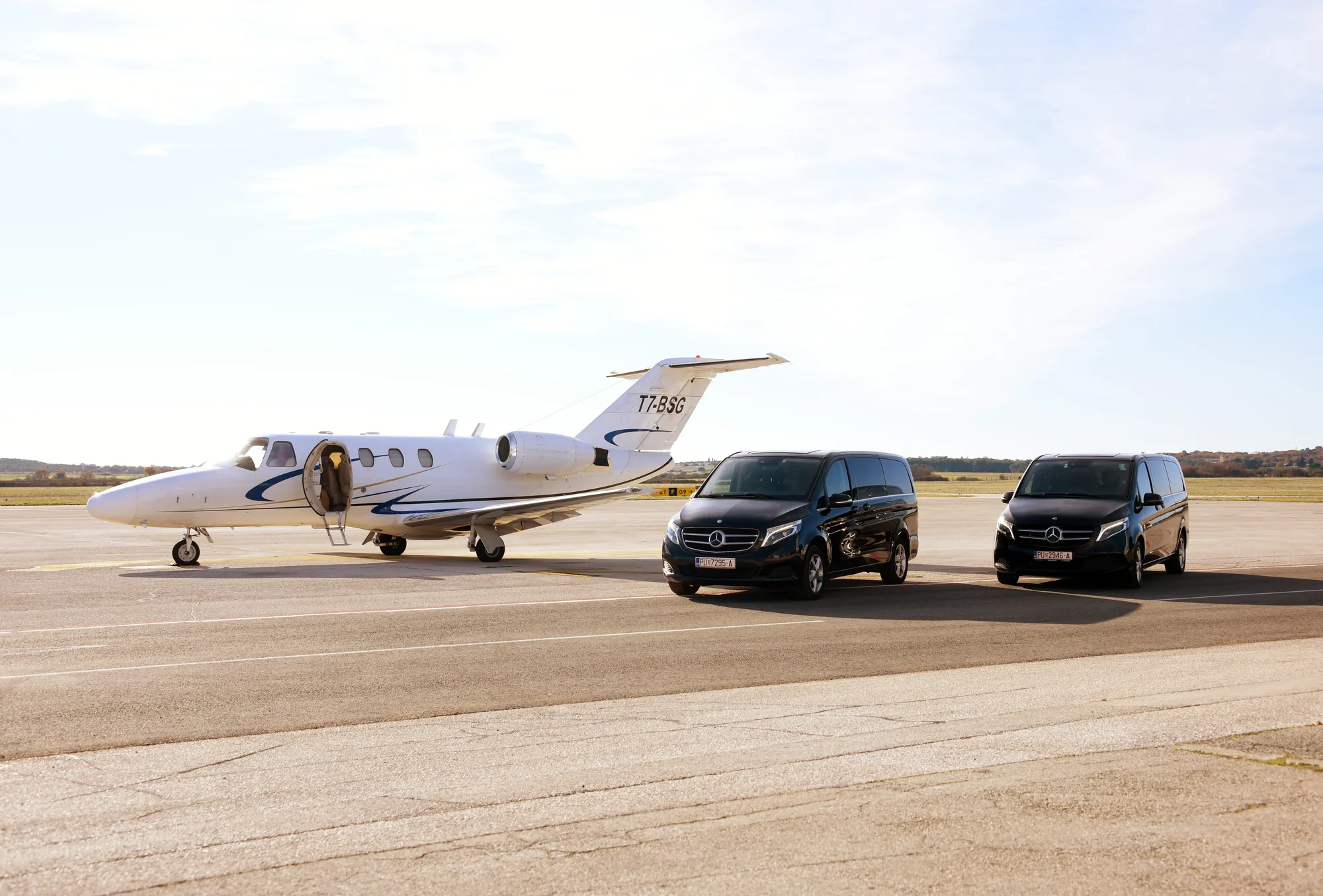 A private jet and a dark Mercedes van, a Belistria transfer for LaMaison in Istria