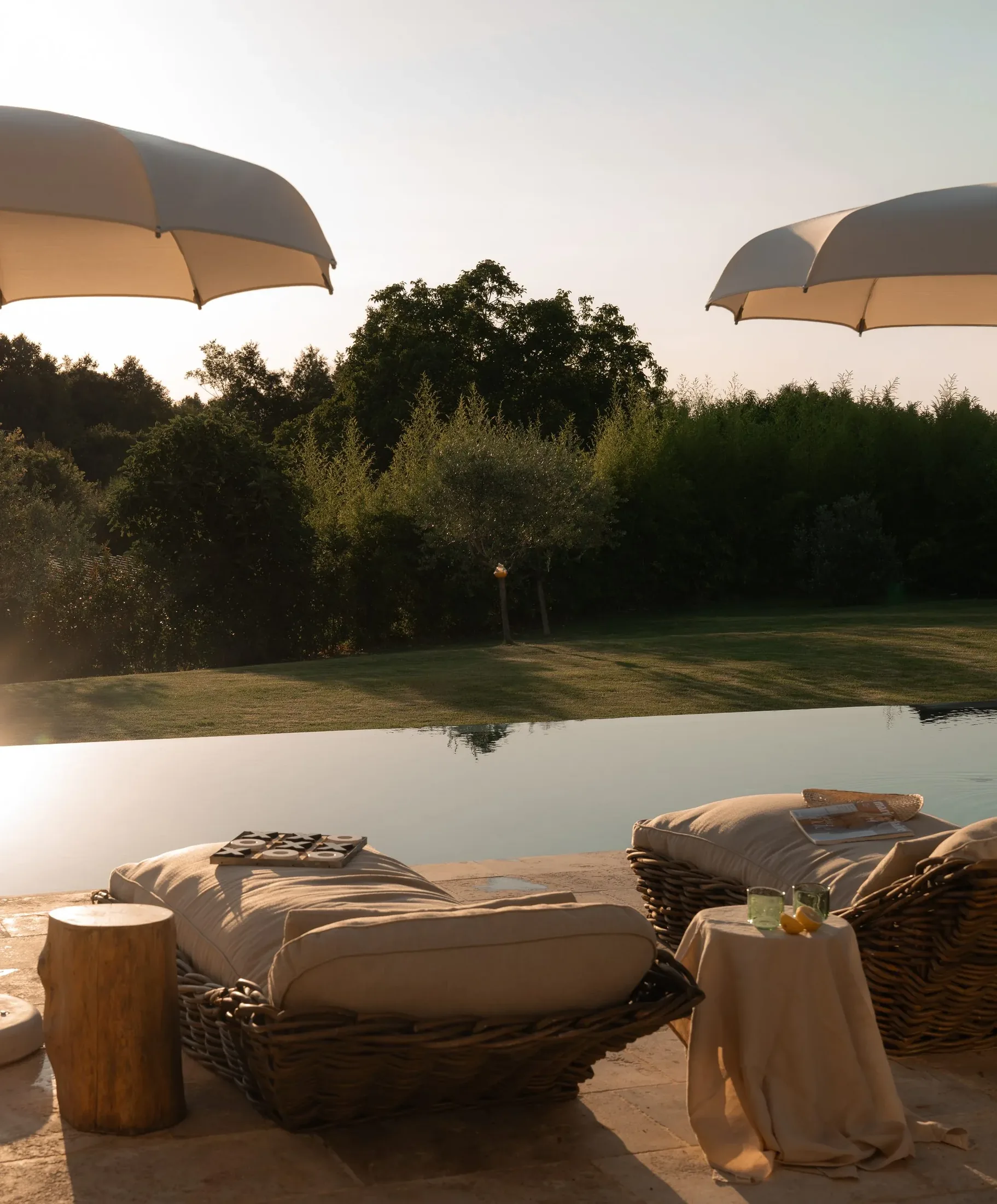 Loungers by the pool at the close of the day at LaMaison